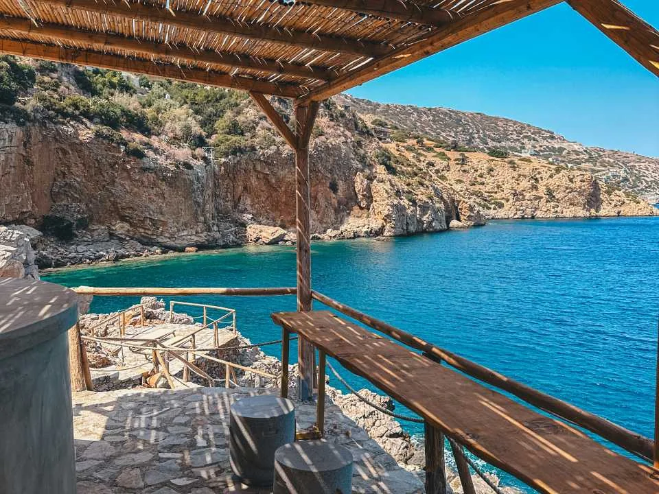 Cliffside open bar above private cove — Meltemi Villa luxury rental Crete