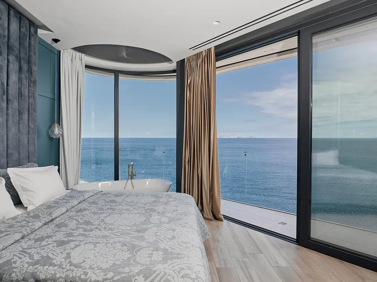Luxury sea-view master bedroom suite with freestanding bathtub — Meltemi Villa Crete